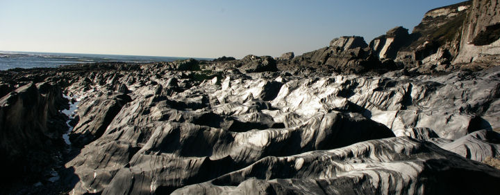 Shiny shist rock reflecting the February sunshine.