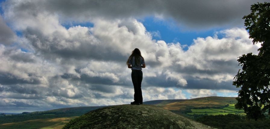 My beautiful wife stood on Mushroom Rock on a warm and humid September day with dramatic skies.