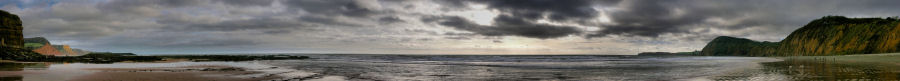 A 180 view of Jacob's Ladder Beach at low tide on a winter's day.